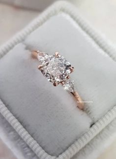 an engagement ring with three diamonds in it