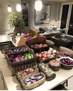 a living room filled with lots of food on top of a table