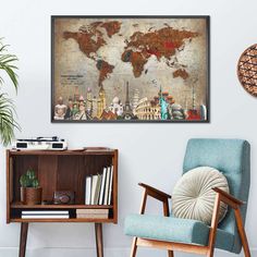 the world map is hanging on the wall above a chair