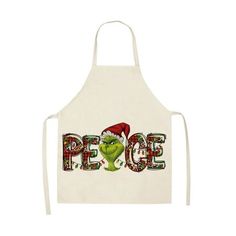 an apron with the grin face on it that says peace and is wearing a santa hat