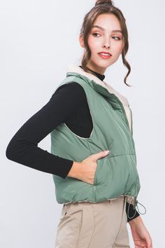 This Reversible Puff Cropped Vest is perfect for those days when you just can’t decide what to wear. With two great colors to choose from, you’ll have plenty of options. Stay stylish and comfortable with this vest, crafted with quality materials to ensure a lasting product. Reversible Puffer Cropped Vest Sage Green and Cream Side Pockets Polyester RESTOCKED Trendy Green Vest Outerwear, Green Layering Vest Outerwear, Green Vest Outerwear For Layering, Green Winter Vest For Cold Weather, Green Winter Vest For Layering, Green Winter Layering Vest, Trendy Green Winter Vest, Puffer Cropped Vest, Puffy Vest Outfit