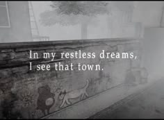 an old photo with the words i'm my restless dreams, i see that town