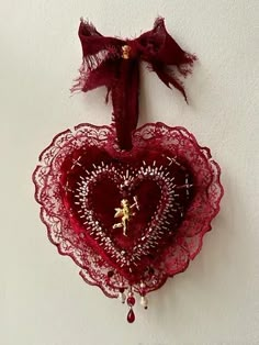 a heart shaped decoration hanging on the wall