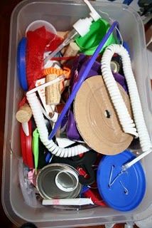 a plastic container filled with assorted items on top of a table