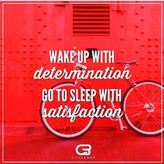 a red bike with the words wake up with determination, go to sleep with satisfaction