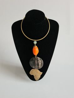 African bone necklace | Necklace made with brass | Classy necklace gift | Handmade Kenyan jewelry. 100% handmade. This masterpiece is made using brass, bone & beads. Perfect for both men and women. **Buy multiple items and pay shipping for 1 item only.The rest ships free. More neckleces here; https://www.etsy.com/shop/TribalTess?ref=seller-platform-mcnav§ion_id=21306083 Back to my shop; https://www.etsy.com/shop/TribalTess?ref=seller-platform-mcnav Kenyan Necklaces, Brass Necklaces With Round Natural Stone Beads, Brass Round Beads Necklace With Natural Stones, Brass Necklace With Round Natural Stone Beads, Handmade Turquoise Necklace With Round Gold Pendant, Handmade Gold Turquoise Necklace With Round Pendant, Bronze Necklace With Round Pendant Of Natural Stones, Bronze Round Pendant Necklace With Natural Stones, Adjustable Bronze Necklace With Unique Variations