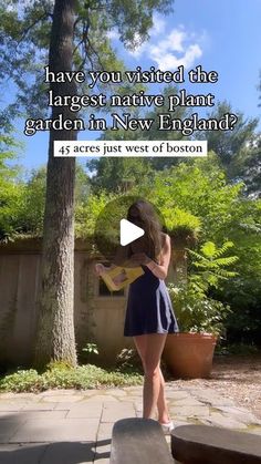 a woman standing in front of a tree with the caption have you visited the largest native plant garden in new england?