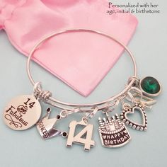 "14th Birthday Charm Bracelet, comes with all charms shown. You select which birthstone and initial you need. All of our jewelry comes beautifully and uniquely packagedready for gift-giving. We can also include a personal note The bangle is adjustable to fit most wrist sizes and is made of jewelry grade stainless steel. Stainless steel bracelets are always our choice for expandable bracelets. Stainless steel ensures your bracelet will never tarnish or lose it's color - it's also easy to care for Birthday Round Charm Bracelet, Handmade Round Charm Bracelet For Birthday, Adjustable Charm Bracelet For Birthday Valentine's Day, Adjustable Charm Bracelet For Birthday And Valentine's Day, Adjustable Charm Bracelet For Birthday And Mother's Day, Adjustable Charm Bracelet For Birthday, Adjustable Charm Bracelet For Birthdays, Adjustable Round Charm Bracelet For Birthday, Silver Bracelet For Birthday, May Birthstone