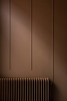 a radiator and some brown walls in a room