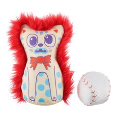 a stuffed animal next to a baseball on a white background with red fur around it