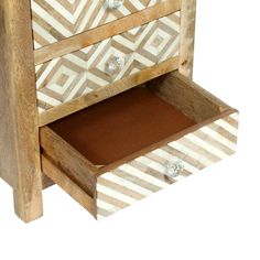 a white and brown wooden dresser with drawers