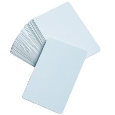 several white cards are stacked on top of each other, with one card in the middle