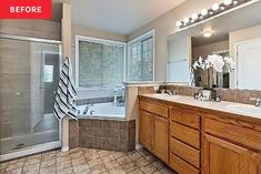 a large bathroom with two sinks and a bathtub next to a walk in shower