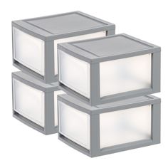 three gray boxes with white lights on them