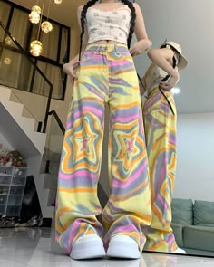 High-waisted yellow trousers with a vibrant star print in soft pastel tones. The wide-leg cut offers comfort and a throwback to 90s fashion Size: • S: Waist: 63cm/ 24.8 in, Hips: 96cm/ 37.8 in, Length: 102cm/ 40.2 in• M: Waist: 67cm/ 26.4 in, Hips: 100cm/ 39.4 in, Length: 103cm/ 40.6 in• L: Waist: 71cm/ 27.9 in, Hips: 104cm/ 40.9 in, Length: 104cm/ 40.9 in• XL: Waist: 75cm/ 29.5 in, Hips: 108cm/ 42.5 in, Length: 105cm/ 41.3 inMaterial: Cotton, Polyester Star Tie Dye, Star Tie, High Waisted Boyfriend Jeans, Denim Decor, Streetwear Jeans, Korean Streetwear, Tie Dye Pattern, Retro Streetwear, Summer Street