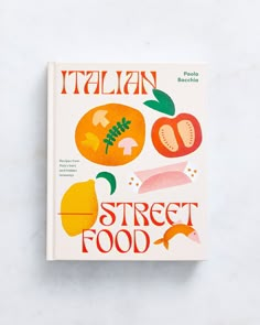 italian street food cookbook on a white surface with oranges, tomatoes and mushrooms