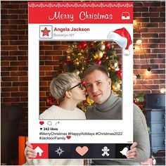 a man and woman are holding up a christmas card