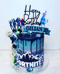 a birthday cake with the name gill to fortnite written on it and decorations