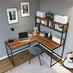 a corner desk with a laptop and guitar on it