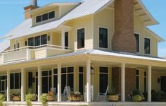 a large yellow house with lots of windows