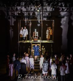 a group of people standing on top of a stage