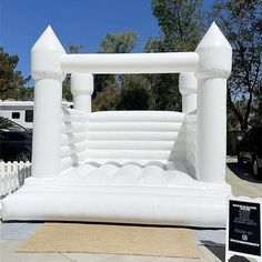 an inflatable bed is set up on the sidewalk