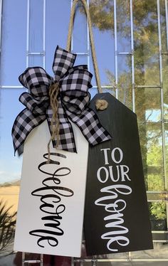 two door hangers decorated with black and white signs