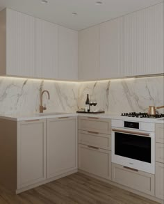 a kitchen with white cabinets and marble counter tops, along with a stove top oven