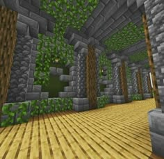 an empty room with lots of green plants on the walls and wood flooring in it