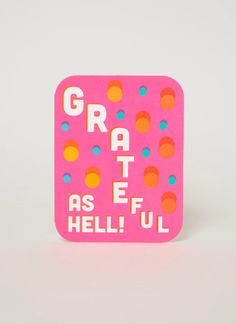 a pink square magnet with colorful dots and the words grateful as if he'll