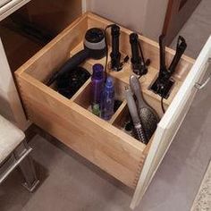 there is a drawer with many items in it