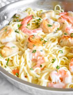 pasta with shrimp and parsley in a pan