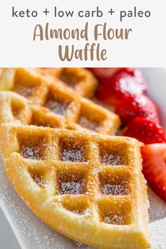 two waffles on a plate with strawberries in the background