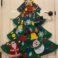 a christmas tree made out of felt on the front door