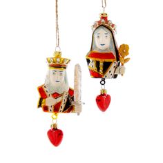 two christmas ornaments hanging from strings on a white background in the shape of king and queen