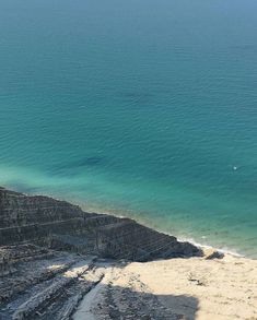 an ocean view from the top of a hill