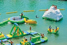 an inflatable water park with people on it