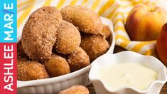 an image of apples and doughnuts with dip in the bowl on the side