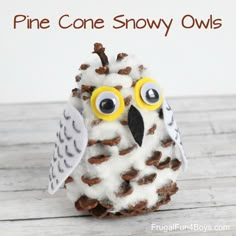 a pine cone snow owl is sitting on a table with the words pine cone snowy owls above it