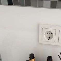 an electrical outlet with two plugs on the wall