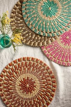 three woven baskets sitting on top of a table