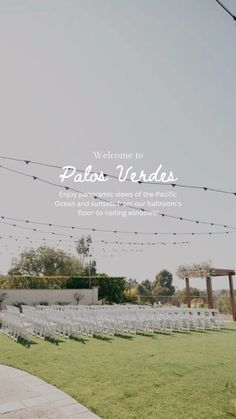 an outdoor ceremony with white chairs and string lights