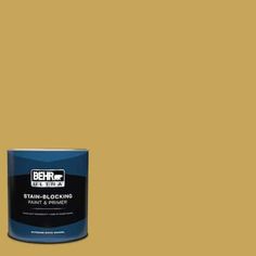 a can of behro ultra stain - blocking paint and primer in gold