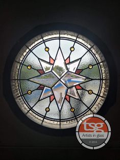 a circular stained glass window in the shape of a star