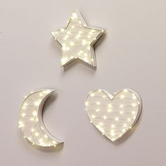 two white stars and a heart shaped light up decoration