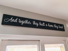 a black and white sign that says and together they built a home they loved on the wall