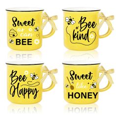 four yellow coffee mugs with the words bee happy, sweet as can bee and bee happy