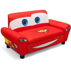 a red couch with blue eyes and lightning bolt on it's head, sitting in front of a white background