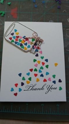 a thank you card with confetti in a jar