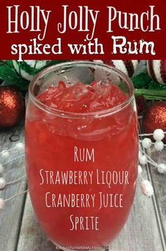 a red drink in a glass with the words holly jolly punch spied with rum